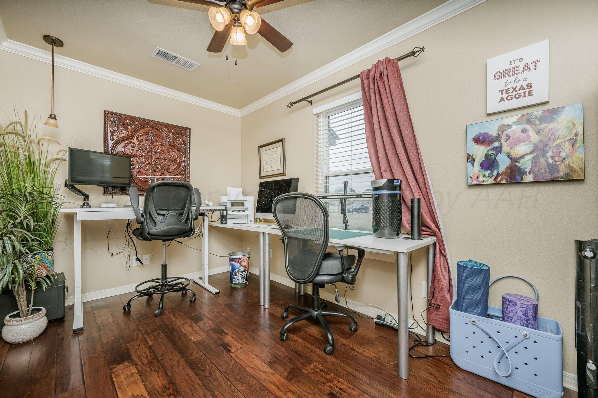 15812 Outback Trail Amarillo, TX 79118 - Photo 22 of 25 a view of a workspace with furniture and a window