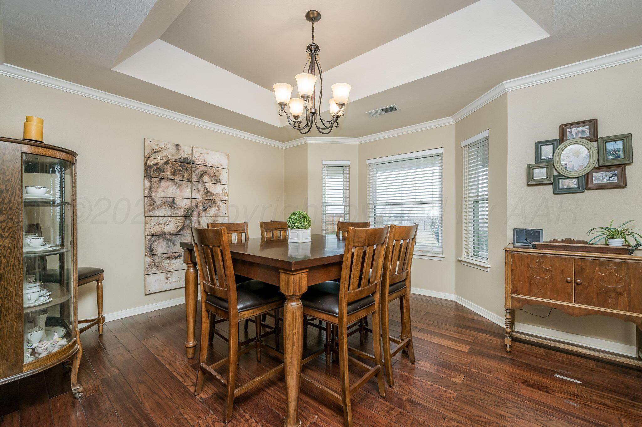 15812 Outback Trail Amarillo, TX 79118 - Photo 10 of 25 a view of a dining room with furniture window and wooden floor