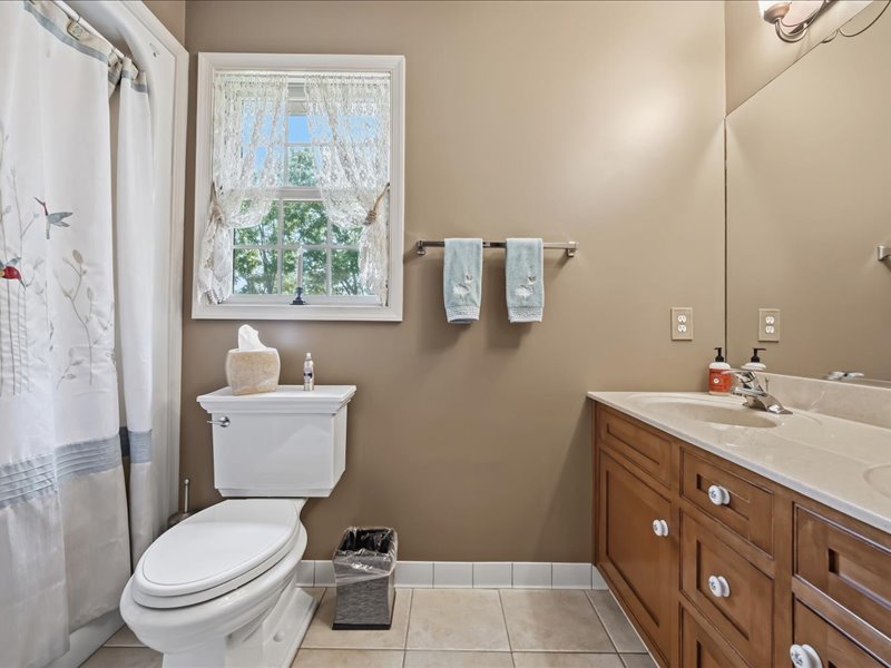 1168 Mt Pleasant Road Bangor, PA 18013 - Photo 76 of 100 Natural light from a classic window illuminates a classic vanity and tiled flooring.