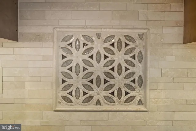 a large kitchen with kitchen island a island a stove a sink a dining table and chairs