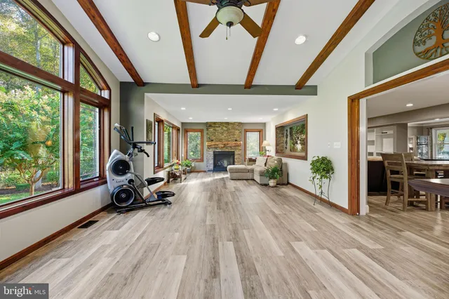 a view of a livingroom with furniture and a floor to ceiling window