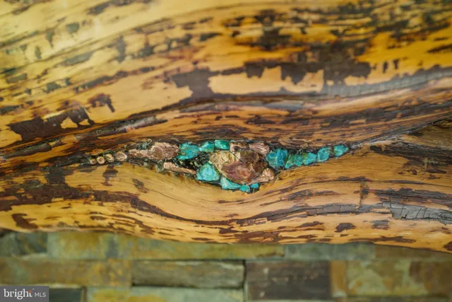 a living room with furniture and large windows