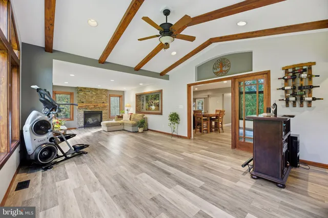 a view of a patio with table and chairs potted plants