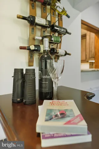 a view of a chair and tables in the balcony