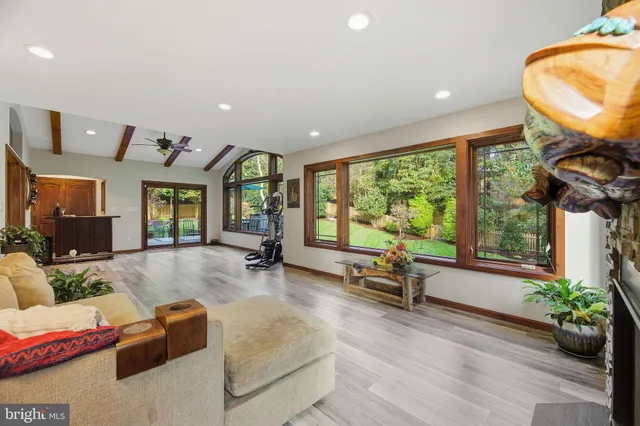 a room with furniture and a bookshelf