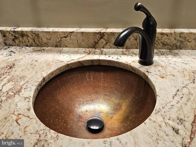 a bedroom with a bed a window and walk in closet