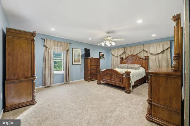 a spacious bathroom with a tub and a shower