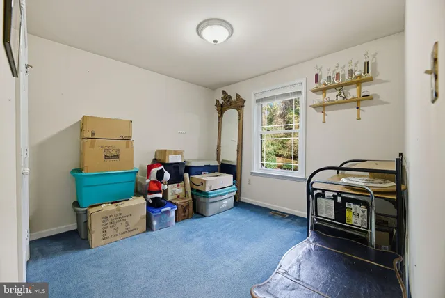 a bed room with furniture and a window