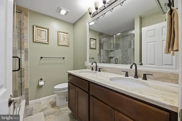 a bedroom with a bed and a cabinets