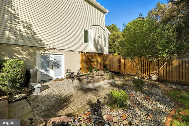 a table and chairs sitting in front of a house