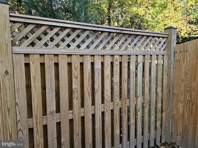 an aerial view of a house with a yard basket ball court and outdoor seating