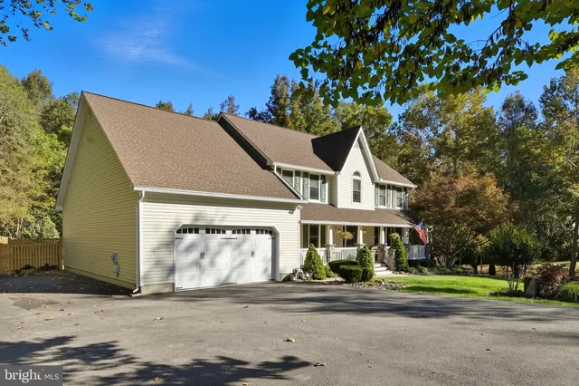a view of house with outdoor space porch and seating space