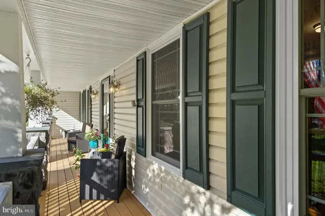 a kitchen with kitchen island a large counter top space and stainless steel appliances