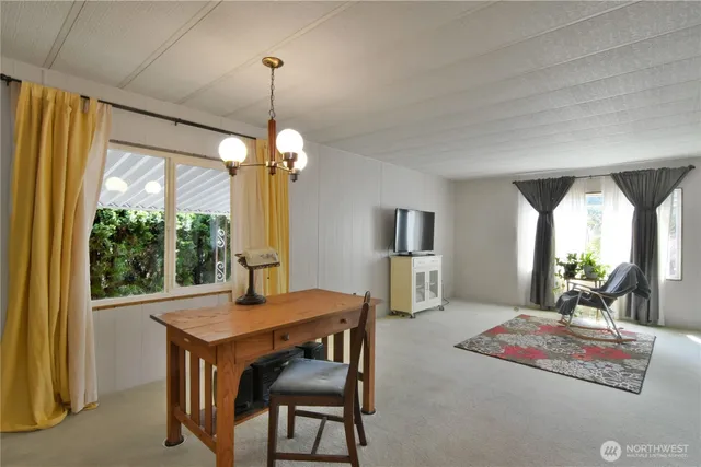 a living room with furniture and a table
