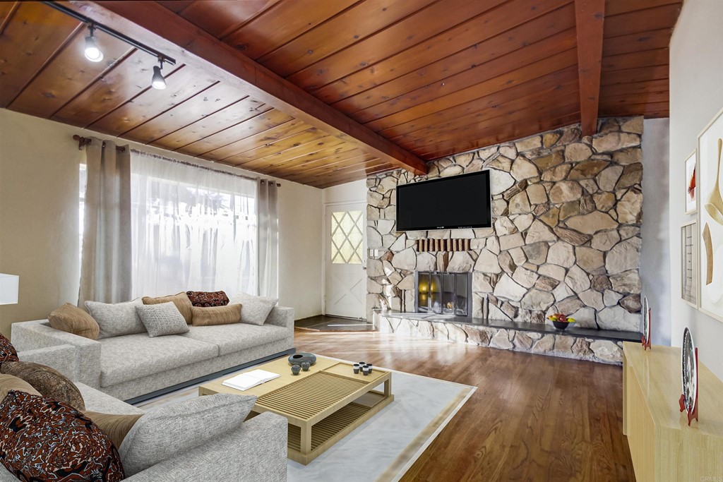 9913 Lindo Lane Lakeside, CA 92040 - Photo 2 of 53 a living room with furniture and a flat screen tv
