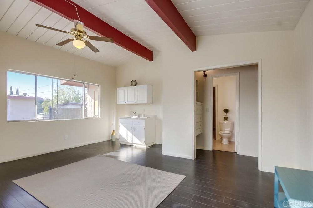 9913 Lindo Lane Lakeside, CA 92040 - Photo 16 of 53 a living room with a bed furniture and a large window