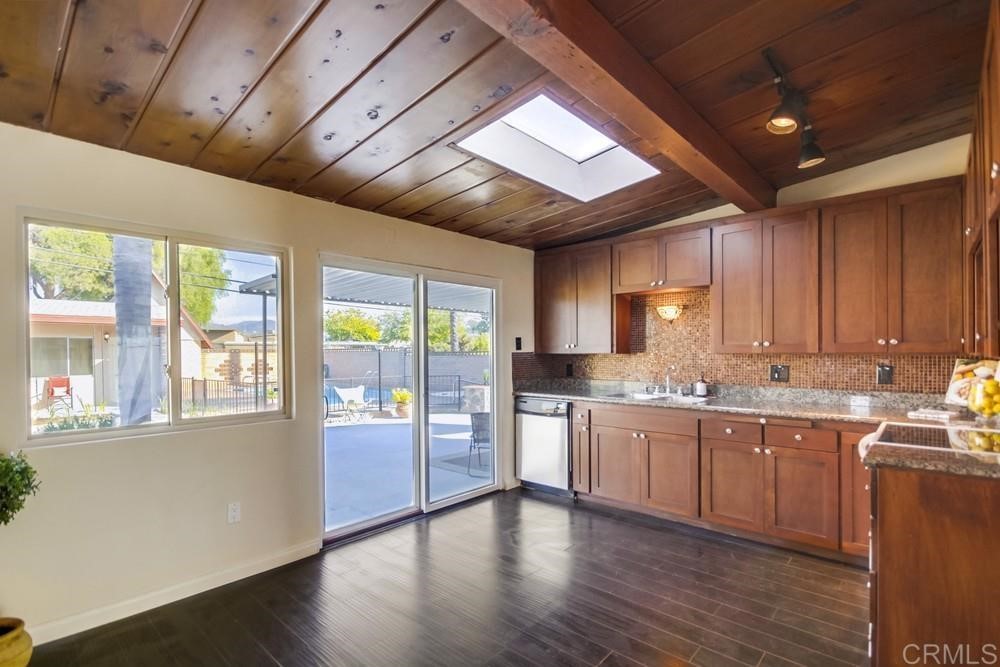 9913 Lindo Lane Lakeside, CA 92040 - Photo 28 of 53 a large kitchen with a large window and wooden floor