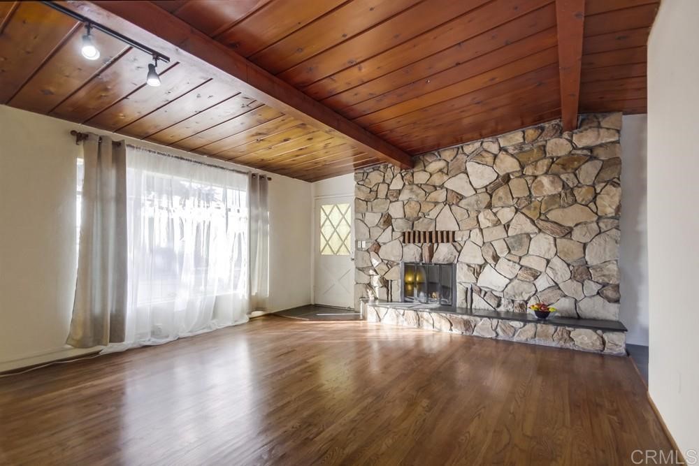 9913 Lindo Lane Lakeside, CA 92040 - Photo 31 of 53 a view of an empty room with wooden floor and a window