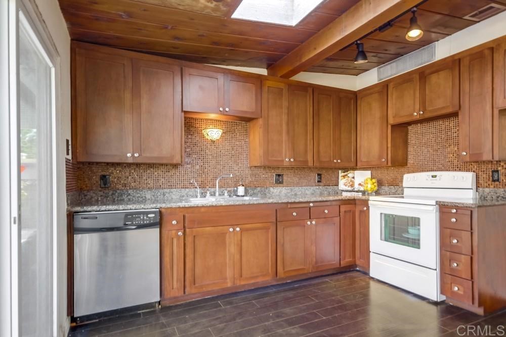 9913 Lindo Lane Lakeside, CA 92040 - Photo 34 of 53 a kitchen with a sink stove and cabinets