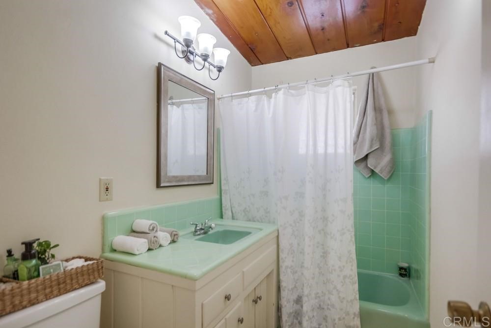 9913 Lindo Lane Lakeside, CA 92040 - Photo 37 of 53 a bathroom with a granite countertop sink and a mirror