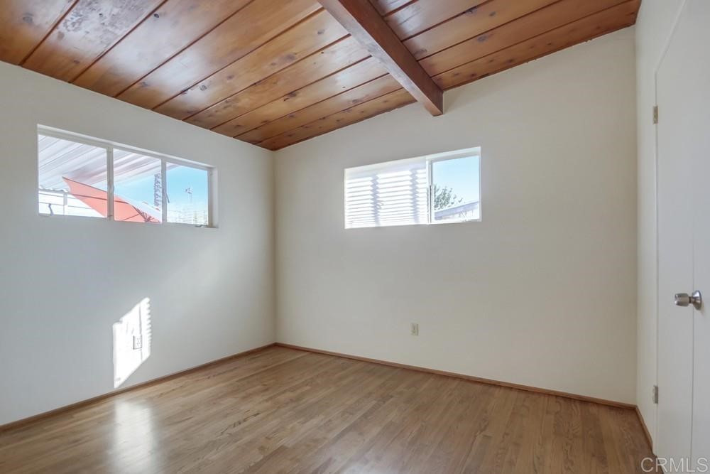 9913 Lindo Lane Lakeside, CA 92040 - Photo 38 of 53 a view of an empty room with wooden floor and a window