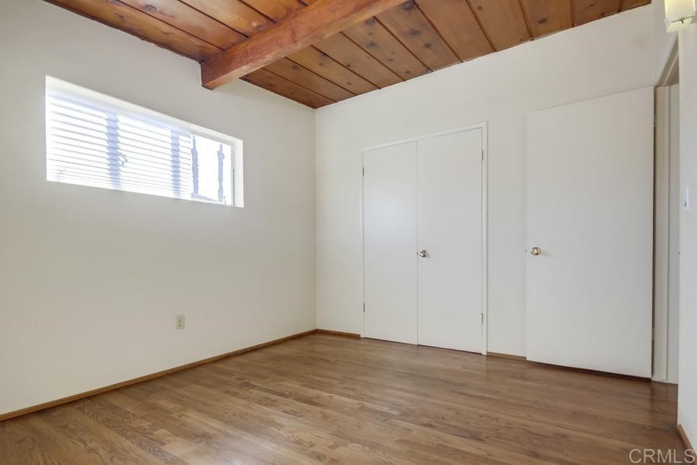 9913 Lindo Lane Lakeside, CA 92040 - Photo 39 of 53 a view of an empty room with wooden floor and a window