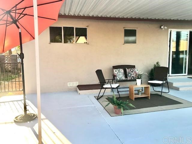 9913 Lindo Lane Lakeside, CA 92040 - Photo 46 of 53 a building outdoor space with patio furniture and potted plants