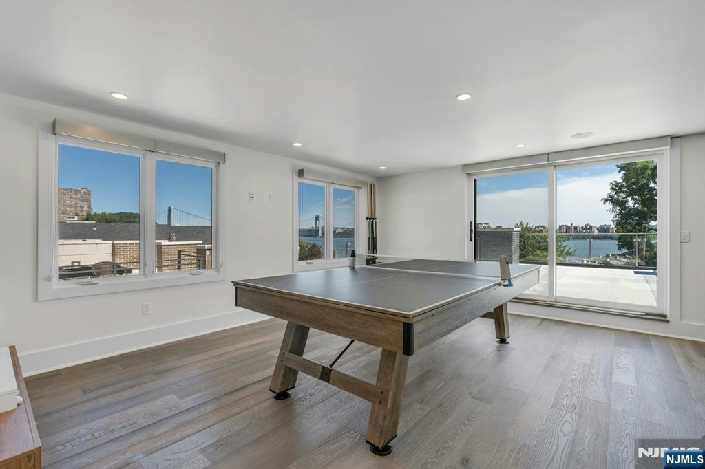 1238 River Road Edgewater, NJ 07020 - Photo 24 of 45 a room with furniture and wooden floor