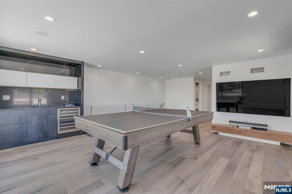 1238 River Road Edgewater, NJ 07020 - Photo 29 of 45 a room with table tennis pool and furniture