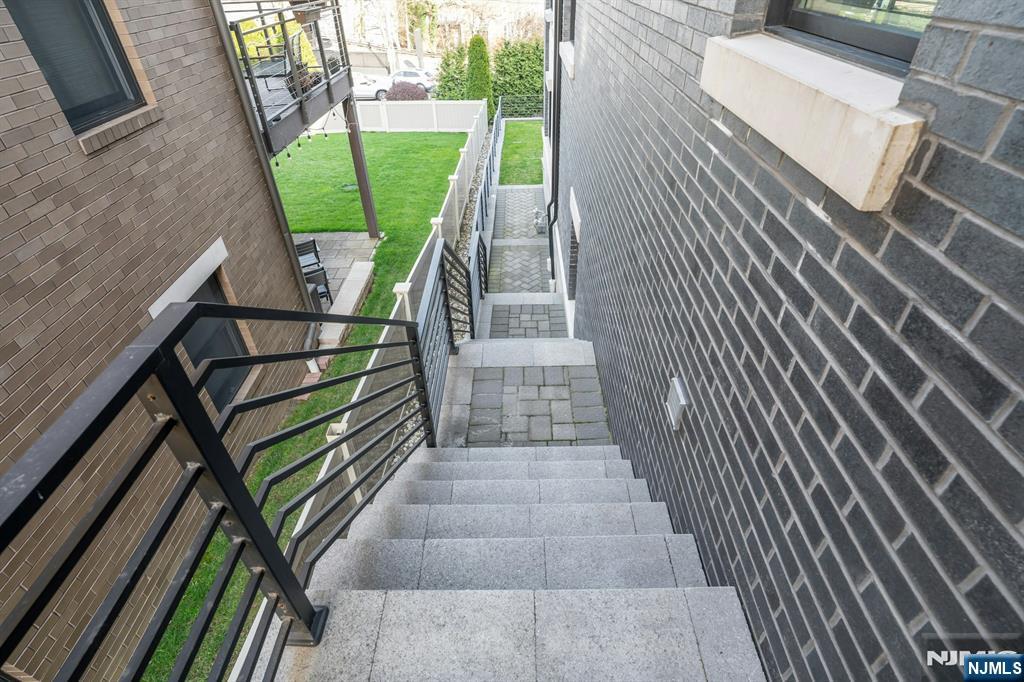 1238 River Road Edgewater, NJ 07020 - Photo 31 of 45 a view of balcony with wooden floor and outdoor seating