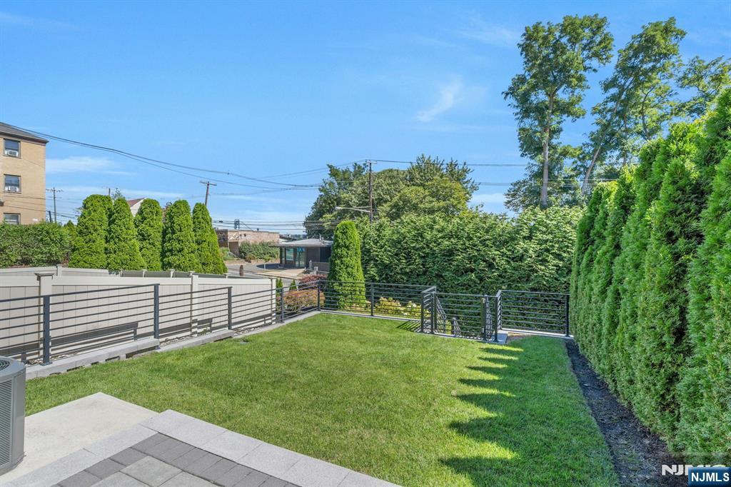 1238 River Road Edgewater, NJ 07020 - Photo 33 of 45 a view of a backyard with a garden