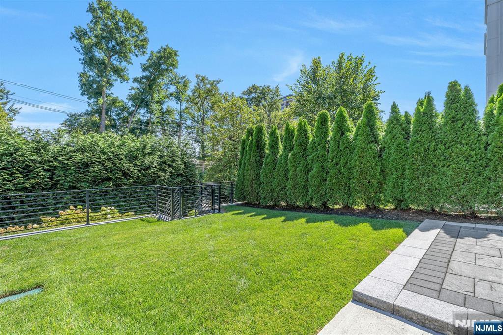1238 River Road Edgewater, NJ 07020 - Photo 34 of 45 a view of a backyard with a garden