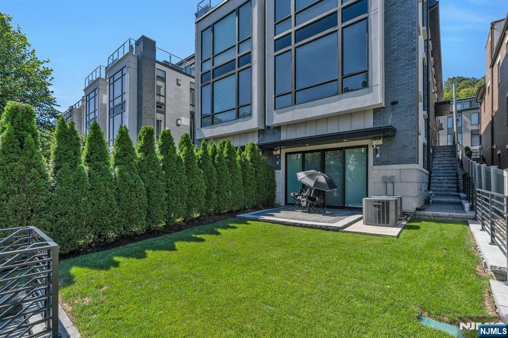 1238 River Road Edgewater, NJ 07020 - Photo 37 of 45 a front view of a house with garden