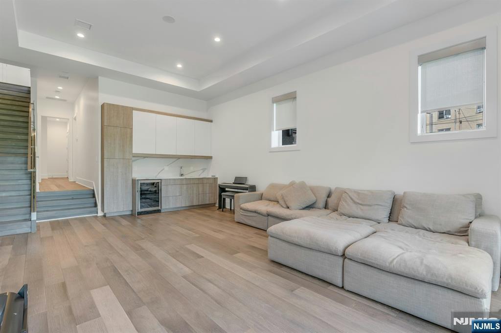 1238 River Road Edgewater, NJ 07020 - Photo 39 of 45 a living room with furniture and a fireplace