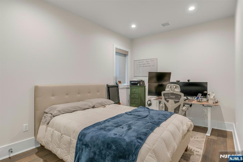 1238 River Road Edgewater, NJ 07020 - Photo 40 of 45 a bedroom with a bed and furniture