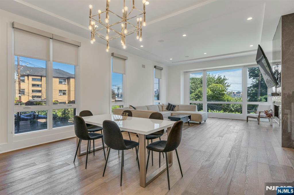 1238 River Road Edgewater, NJ 07020 - Photo 7 of 45 a view of a dining room with furniture window and wooden floor