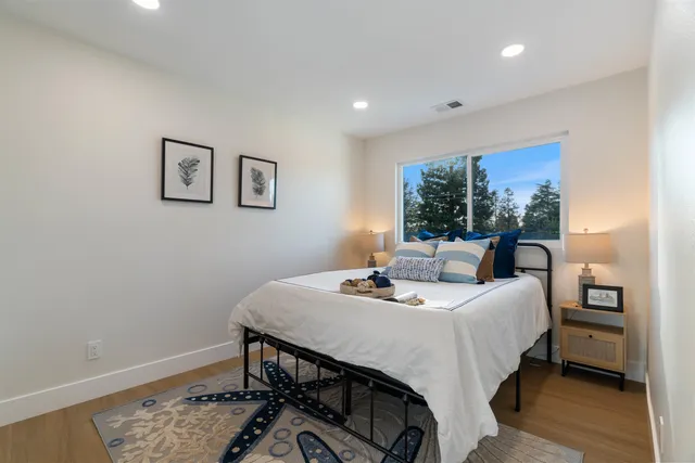 a front view of a house with a yard and porch