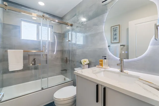 an aerial view of a house with garden space and street view