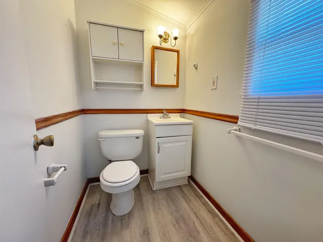 a bathroom with a toilet and a sink