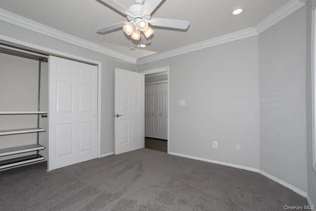 an empty room with a ceiling fan