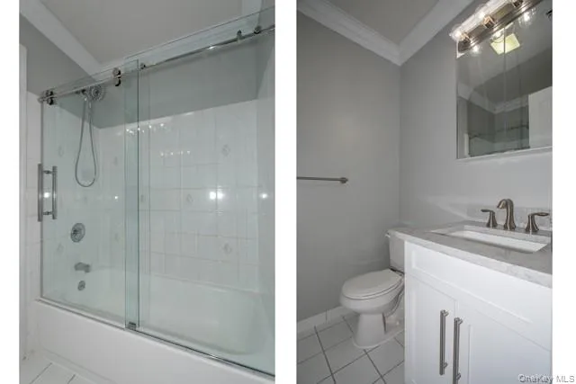 a bathroom with a granite countertop sink a toilet and shower