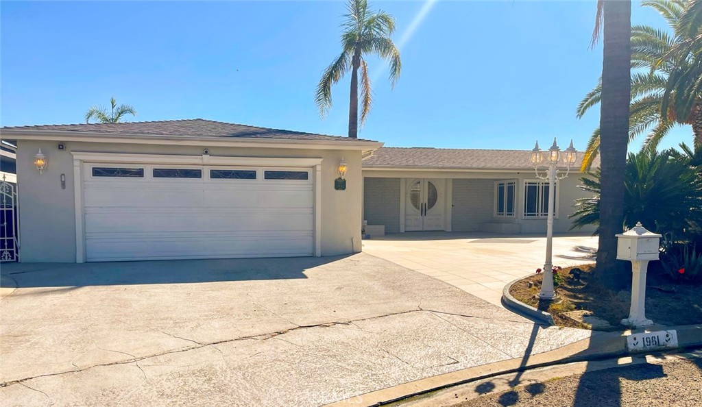 a view of a house with a backyard