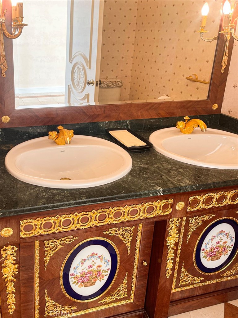 1981 Deermont Road Glendale, CA 91207 - Photo 13 of 49 a bathroom with a granite countertop sink and a mirror