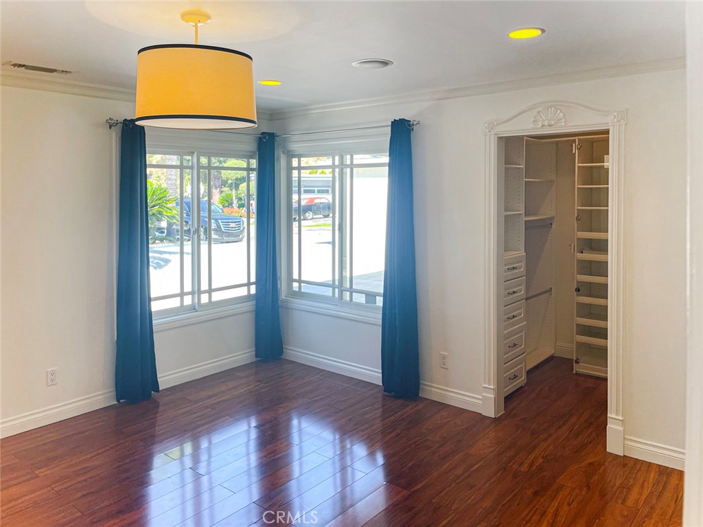 1981 Deermont Road Glendale, CA 91207 - Photo 23 of 49 an empty room with wooden floor and windows