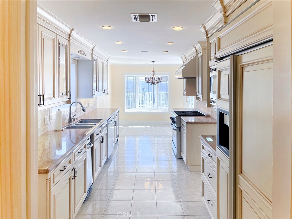 1981 Deermont Road Glendale, CA 91207 - Photo 27 of 49 a kitchen with stainless steel appliances granite countertop a stove and a refrigerator