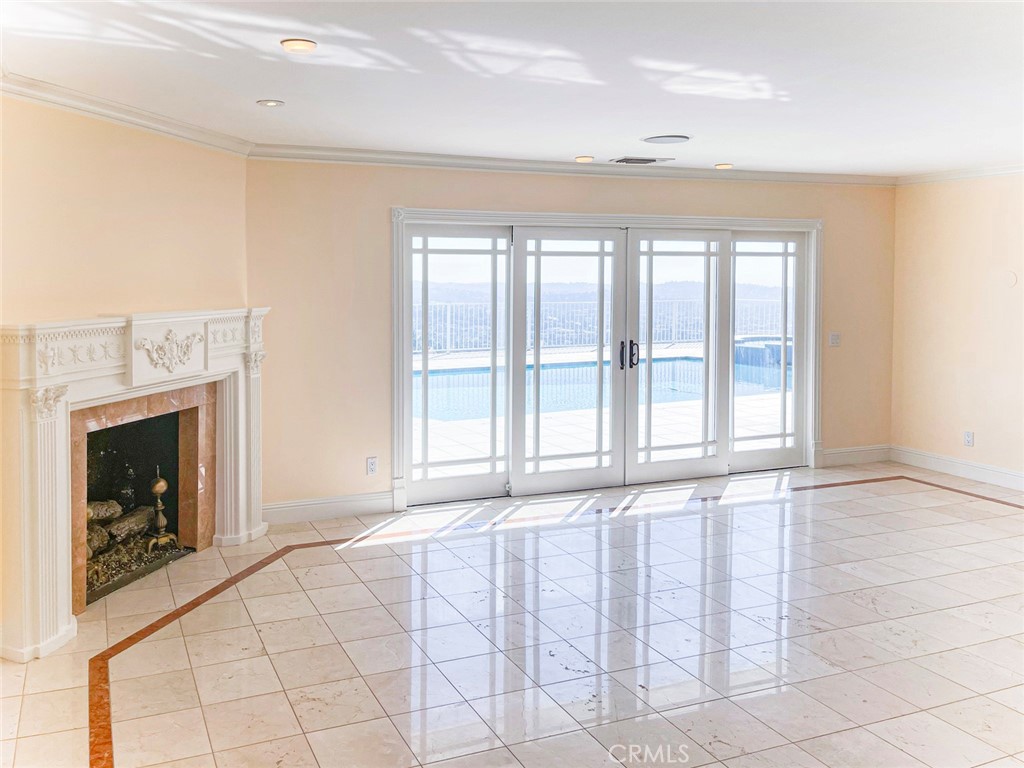 1981 Deermont Road Glendale, CA 91207 - Photo 30 of 49 a view of an empty room with a fireplace and a window