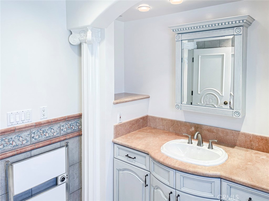 1981 Deermont Road Glendale, CA 91207 - Photo 34 of 49 a bathroom with a sink and a mirror
