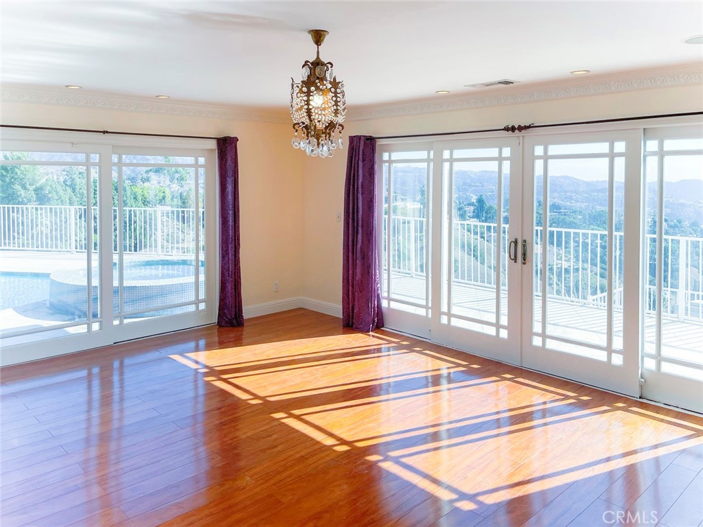 1981 Deermont Road Glendale, CA 91207 - Photo 39 of 49 a room with wooden floor and windows