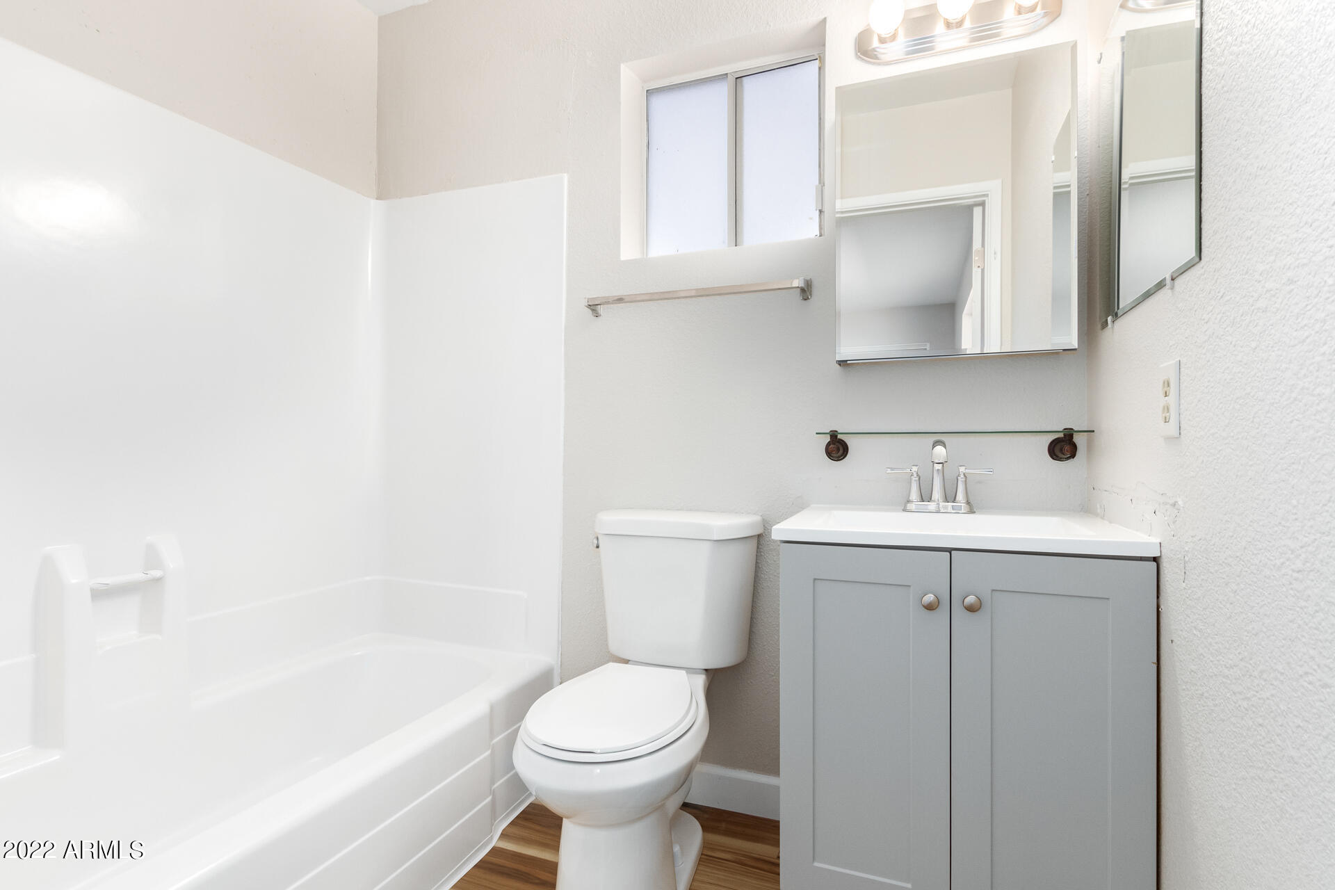 1225 West Halstead Drive Phoenix, AZ 85023 - Photo 11 of 19 a bathroom with a sink toilet and shower