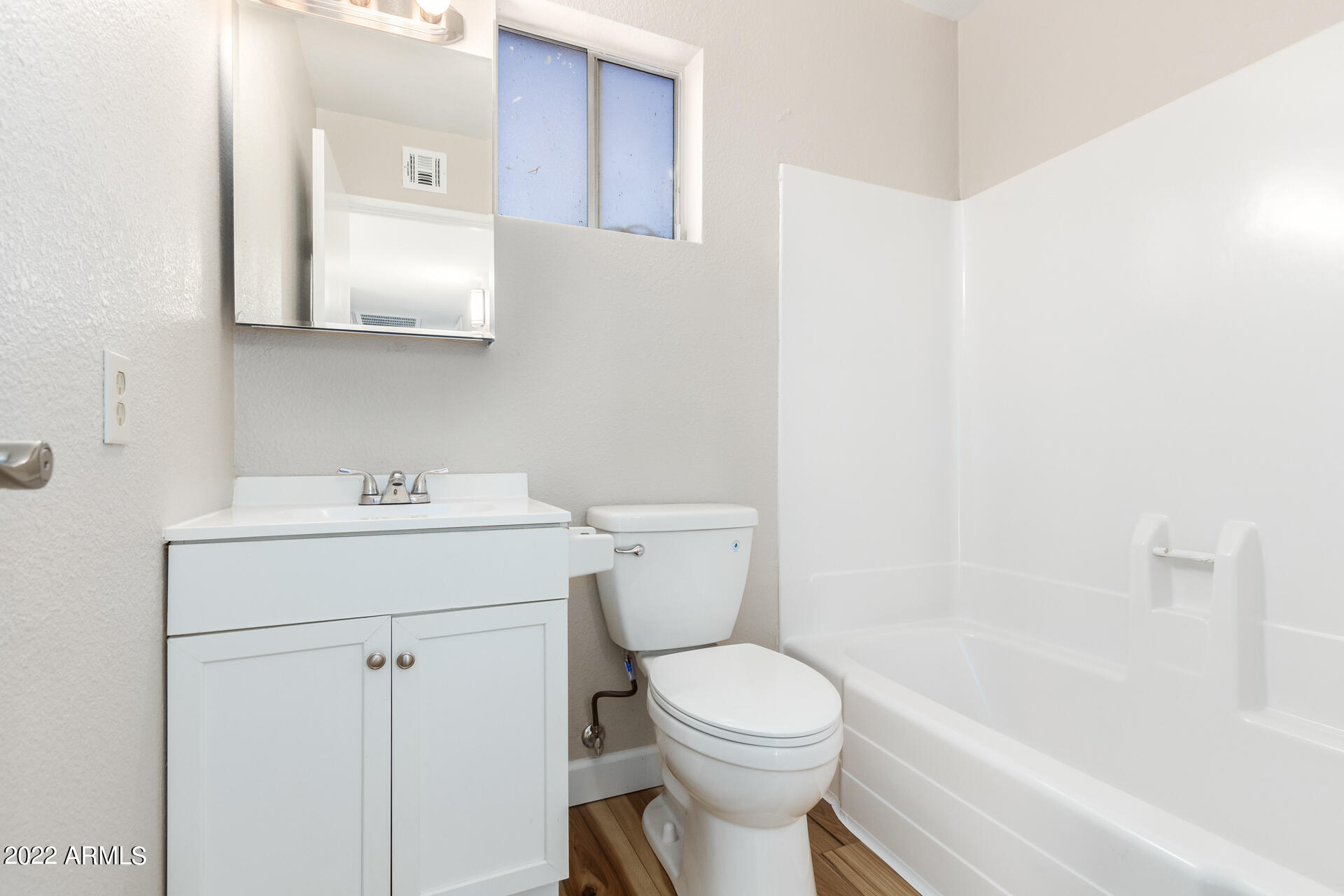 1225 West Halstead Drive Phoenix, AZ 85023 - Photo 14 of 19 a bathroom with a sink a toilet and bathtub